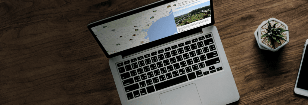 Footer banner with view of Wemap map open on computer